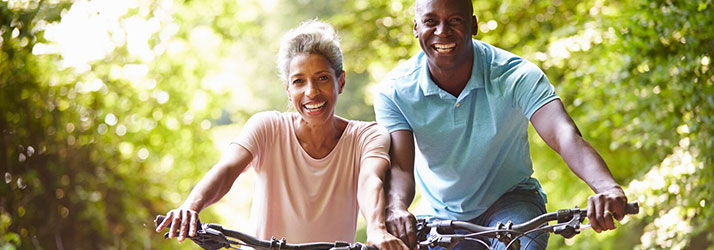 Chiropractic Delray Beach FL Wellness Biking Couple